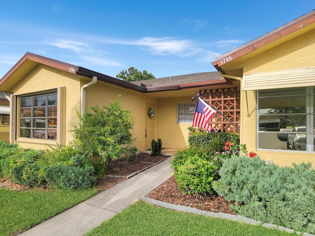 1744 Lakefront Blvd Unit C, Fort Pierce, FL 34982 - doorway to property featuring stucco siding