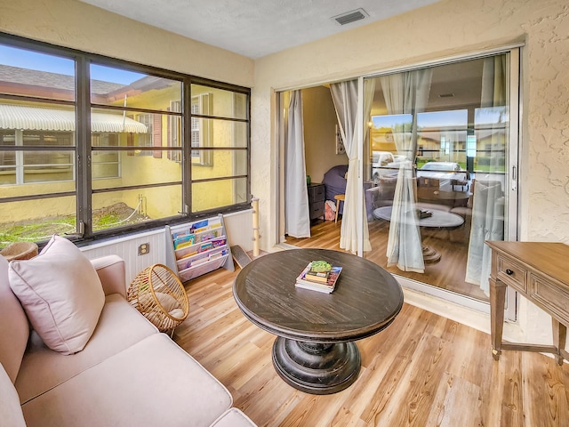 1744 Lakefront Blvd Unit C, Fort Pierce, FL 34982 - living room featuring wood finished floors and plenty of natural light