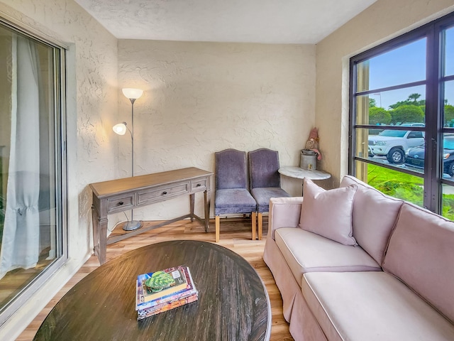 1744 Lakefront Blvd Unit C, Fort Pierce, FL 34982 - living room featuring a textured wall and wood finished floors