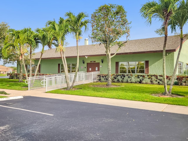 1744 Lakefront Blvd Unit C, Fort Pierce, FL 34982 - ranch-style house featuring stucco siding, uncovered parking, and a shingled roof