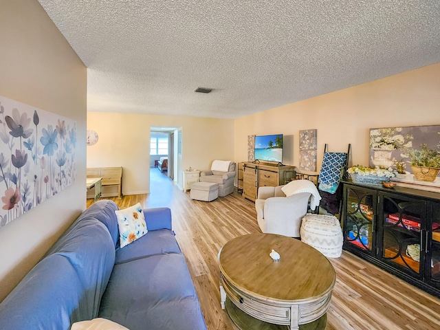1744 Lakefront Blvd Unit C, Fort Pierce, FL 34982 - living area featuring light wood-style flooring and a textured ceiling