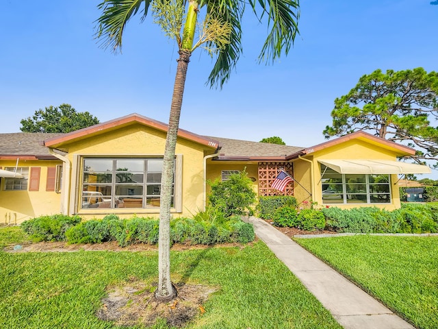 1744 Lakefront Blvd Unit C, Fort Pierce, FL 34982 - single story home featuring stucco siding and a front lawn