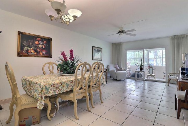12022 W Greenway Dr Unit 201, Royal Palm Beach, FL 33411 - dining area featuring a chandelier, light tile patterned floors, and a ceiling fan