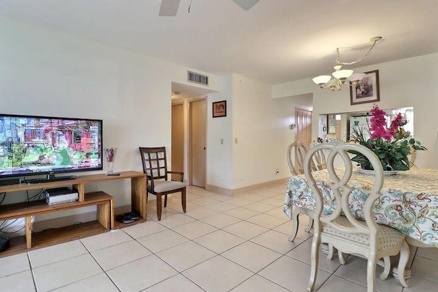 12022 W Greenway Dr Unit 201, Royal Palm Beach, FL 33411 - dining room with a chandelier, light tile patterned floors, and a ceiling fan