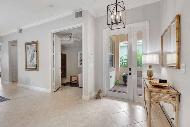 202 Isle Verde Way, Palm Beach Gardens, FL 33418 - foyer featuring crown molding, baseboards, a chandelier, and light tile patterned floors