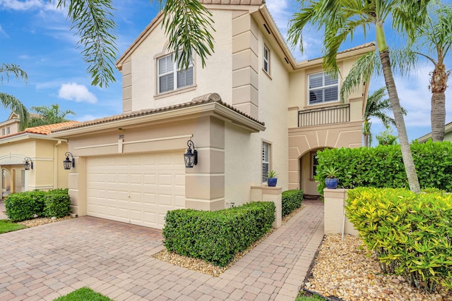 202 Isle Verde Way, Palm Beach Gardens, FL 33418 - view of front of property with stucco siding, a garage, decorative driveway, and a tile roof