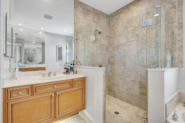 202 Isle Verde Way, Palm Beach Gardens, FL 33418 - bathroom with a stall shower, vanity, a garden tub, tile patterned floors, and recessed lighting