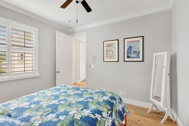 202 Isle Verde Way, Palm Beach Gardens, FL 33418 - bedroom featuring multiple windows, light wood finished floors, ornamental molding, baseboards, and a ceiling fan