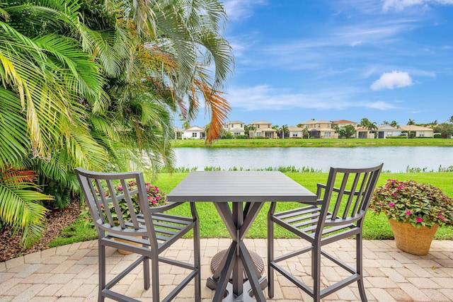 202 Isle Verde Way, Palm Beach Gardens, FL 33418 - view of patio / terrace featuring a water view and a residential view