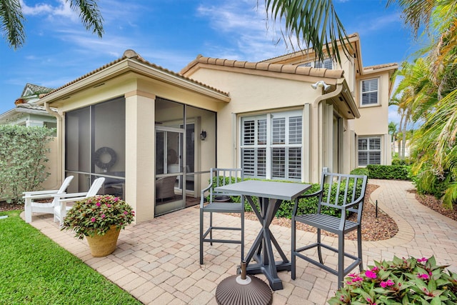 202 Isle Verde Way, Palm Beach Gardens, FL 33418 - view of patio / terrace with a sunroom