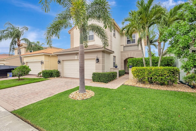 202 Isle Verde Way, Palm Beach Gardens, FL 33418 - mediterranean / spanish-style home with stucco siding, decorative driveway, a front yard, and a tiled roof