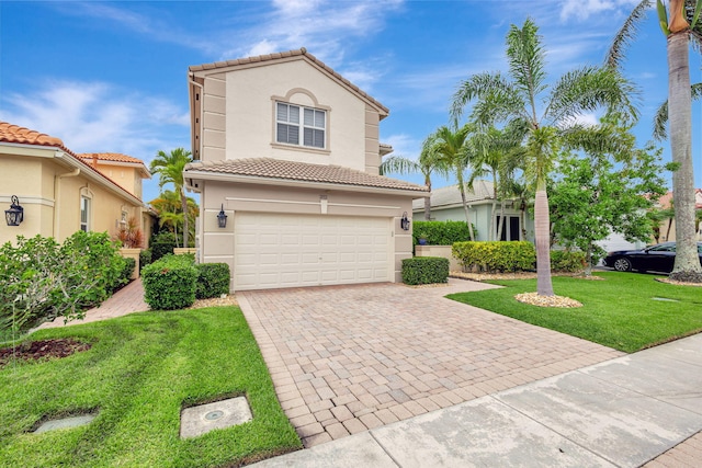 202 Isle Verde Way, Palm Beach Gardens, FL 33418 - mediterranean / spanish home featuring an attached garage, decorative driveway, stucco siding, and a tile roof
