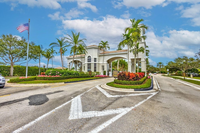202 Isle Verde Way, Palm Beach Gardens, FL 33418 - view of asphalt road with curbs, sidewalks, and street lights