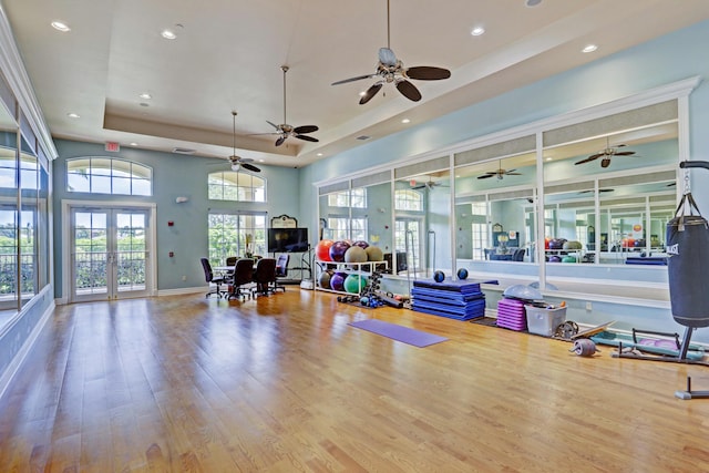 202 Isle Verde Way, Palm Beach Gardens, FL 33418 - exercise room with a tray ceiling, recessed lighting, french doors, wood finished floors, and ceiling fan