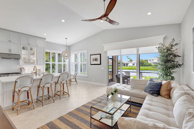 202 Isle Verde Way, Palm Beach Gardens, FL 33418 - living area with vaulted ceiling, light tile patterned flooring, ceiling fan, baseboards, and recessed lighting
