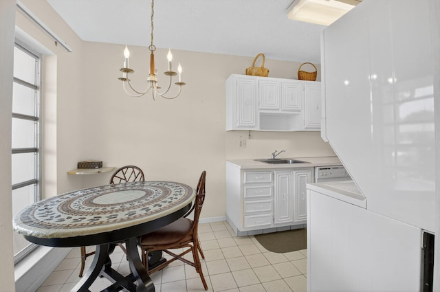 8644 Boca Dr, Boca Raton, FL 33433 - dining room with a chandelier, light tile patterned flooring, and washer / clothes dryer