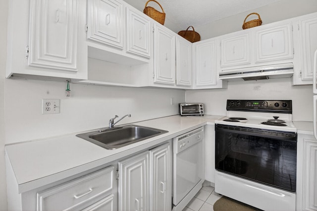 8644 Boca Dr, Boca Raton, FL 33433 - kitchen with white appliances, under cabinet range hood, white cabinetry, and light countertops