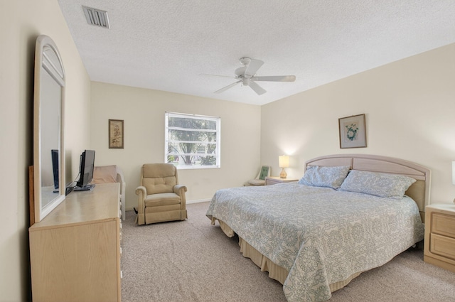 8644 Boca Dr, Boca Raton, FL 33433 - bedroom featuring light carpet, a textured ceiling, and ceiling fan