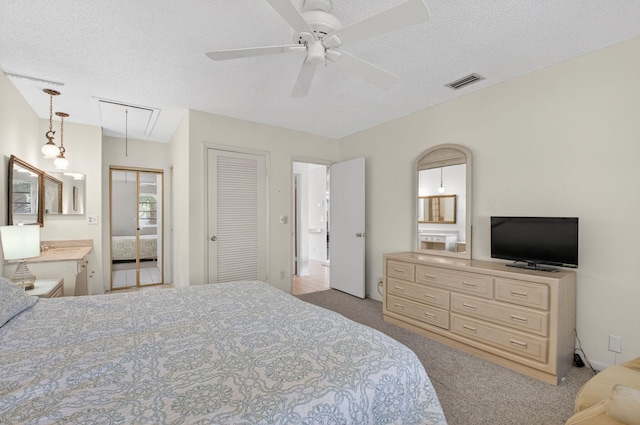 8644 Boca Dr, Boca Raton, FL 33433 - carpeted bedroom featuring attic access, a textured ceiling, and a ceiling fan