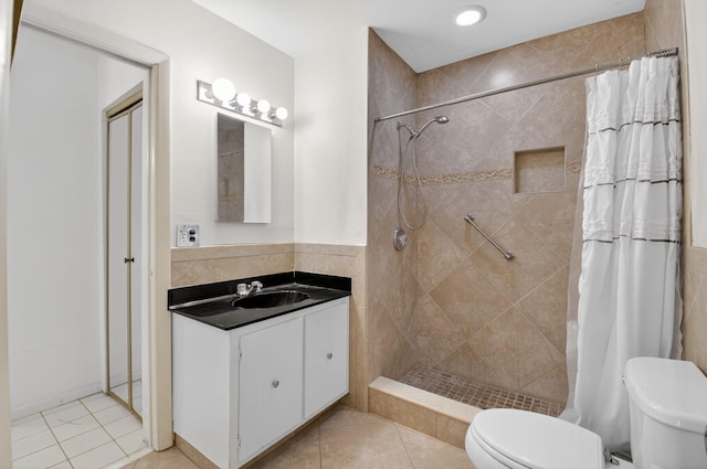 8644 Boca Dr, Boca Raton, FL 33433 - bathroom with vanity, tiled shower, and tile patterned floors