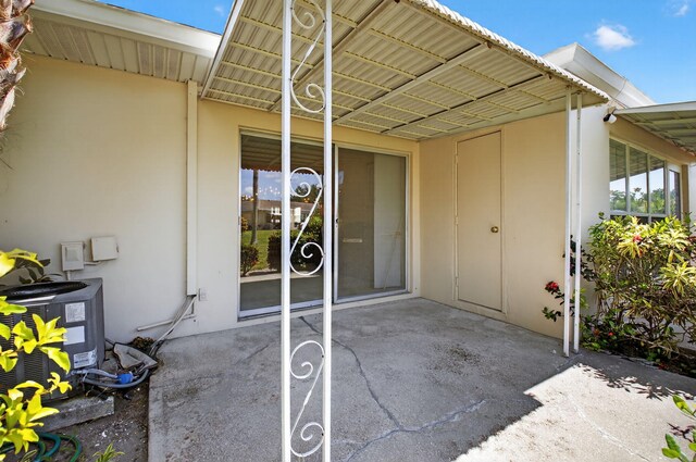 8644 Boca Dr, Boca Raton, FL 33433 - view of patio / terrace featuring an attached carport