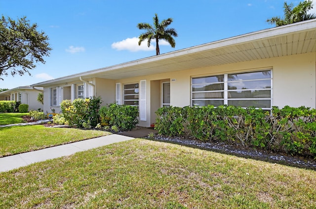8644 Boca Dr, Boca Raton, FL 33433 - single story home featuring stucco siding and a front lawn