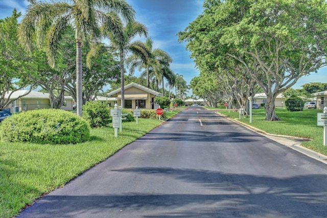 8644 Boca Dr, Boca Raton, FL 33433 - view of asphalt road with traffic signs