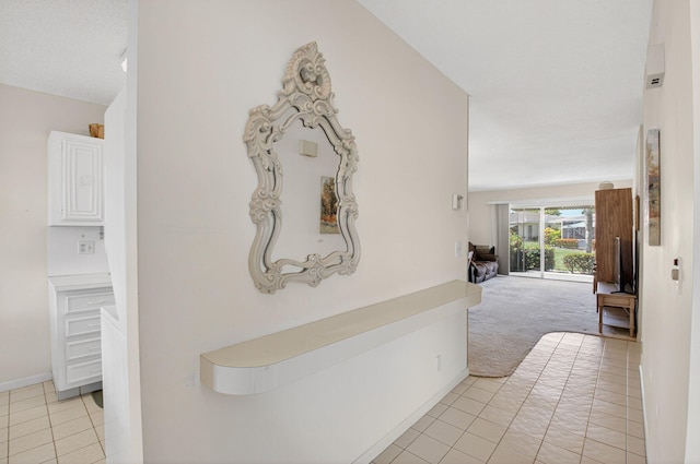 8644 Boca Dr, Boca Raton, FL 33433 - hall featuring light tile patterned flooring and light colored carpet