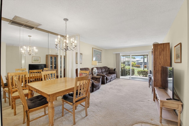 8644 Boca Dr, Boca Raton, FL 33433 - dining room with light colored carpet, a chandelier, and a textured ceiling