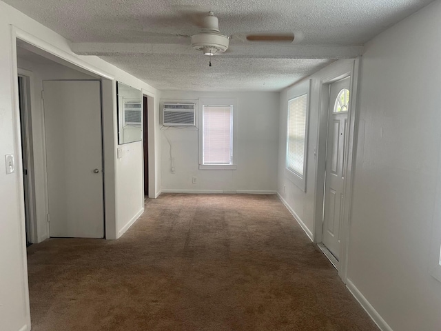 2618 Nokomis Ave, West Palm Beach, FL 33409 - corridor featuring carpet floors, an AC wall unit, a textured ceiling, and baseboards