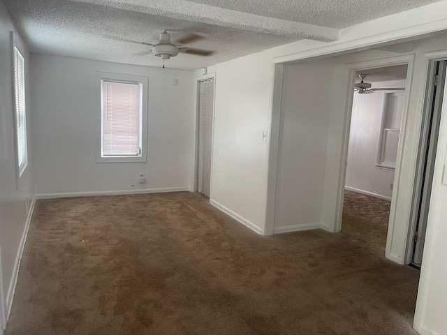 2618 Nokomis Ave, West Palm Beach, FL 33409 - empty room featuring ceiling fan, carpet, healthy amount of natural light, a textured ceiling, and baseboards