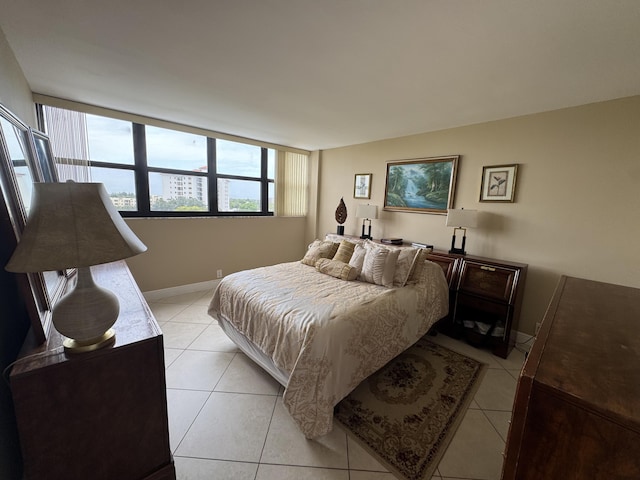 336 Golfview Rd Unit 706, North Palm Beach, FL 33408 - bedroom featuring light tile patterned floors and baseboards