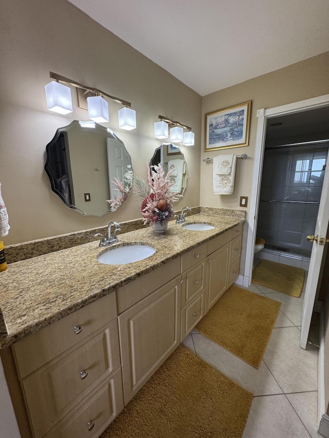 336 Golfview Rd Unit 706, North Palm Beach, FL 33408 - bathroom with double vanity, tile patterned flooring, and a shower with shower door