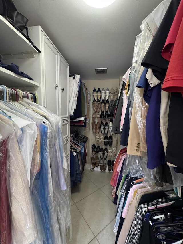 336 Golfview Rd Unit 706, North Palm Beach, FL 33408 - walk in closet with light tile patterned floors