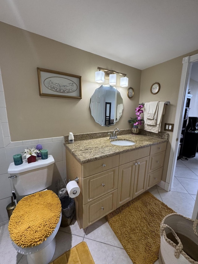 336 Golfview Rd Unit 706, North Palm Beach, FL 33408 - bathroom with tile patterned flooring, vanity, and tile walls