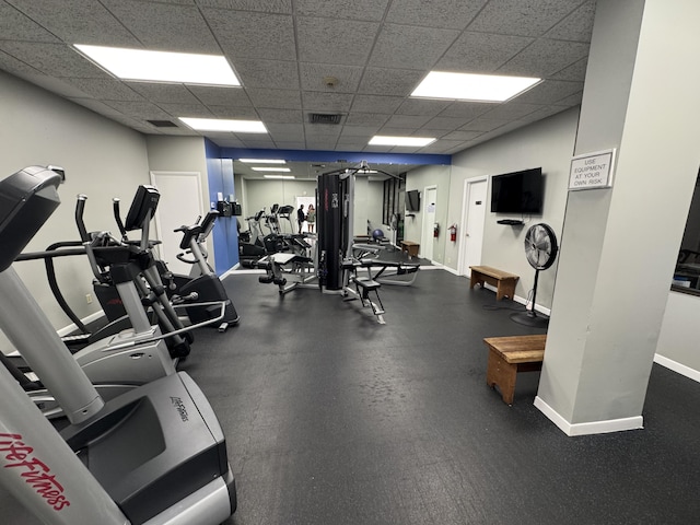 336 Golfview Rd Unit 706, North Palm Beach, FL 33408 - gym featuring baseboards and a drop ceiling