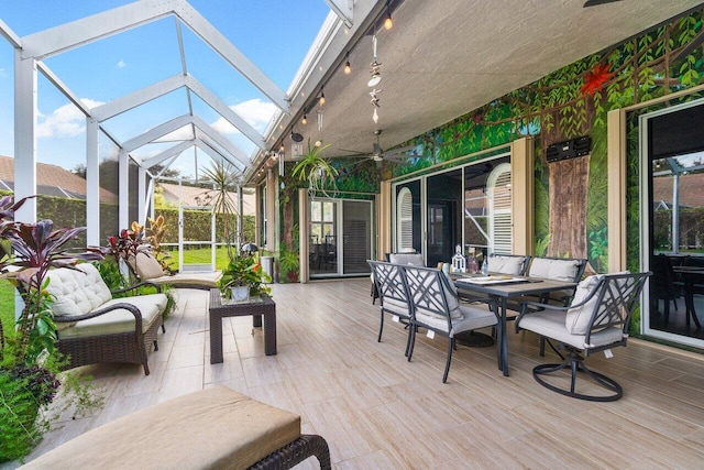 7465 Rockbridge Cir, Lake Worth, FL 33467 - sunroom featuring ceiling fan, outdoor dining area, and rail lighting