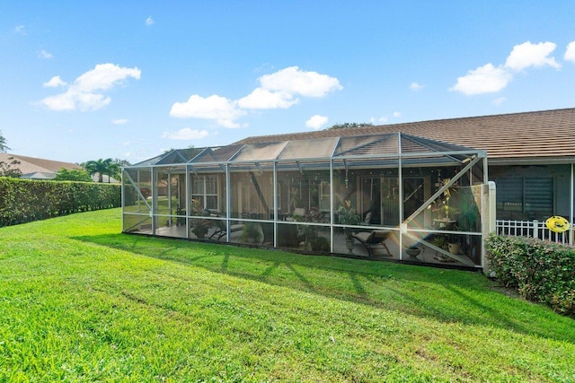 7465 Rockbridge Cir, Lake Worth, FL 33467 - back of house featuring a yard and a lanai