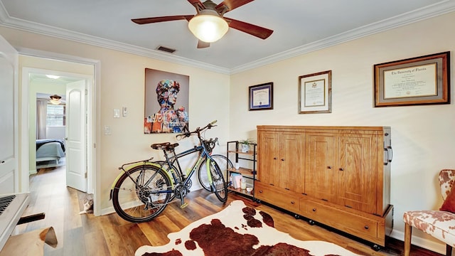 3001 W Linton Blvd Unit 204C, Delray Beach, FL 33445 - living area featuring ceiling fan, crown molding, wood finished floors, and baseboards