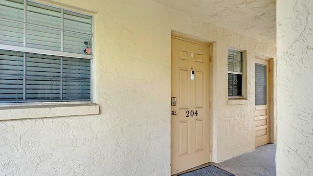 3001 W Linton Blvd Unit 204C, Delray Beach, FL 33445 - property entrance featuring stucco siding