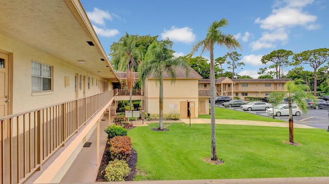 3001 W Linton Blvd Unit 204C, Delray Beach, FL 33445 - view of property's community featuring uncovered parking, a lawn, and a residential view
