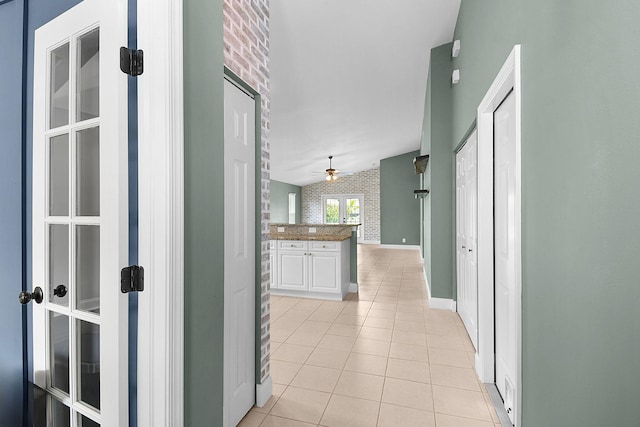 2867 SW Mustang Ter, Stuart, FL 34997 - hallway with light tile patterned floors