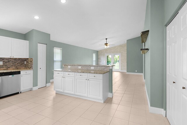 2867 SW Mustang Ter, Stuart, FL 34997 - kitchen featuring stainless steel dishwasher, ceiling fan, baseboards, backsplash, and light tile patterned floors