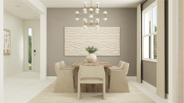 19153 Wood Stork Way, Loxahatchee, FL 33470 - dining space featuring a chandelier, healthy amount of natural light, light tile patterned floors, and baseboards