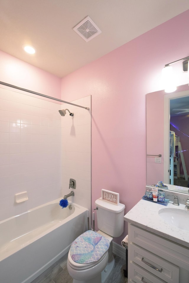 10299 SW Captiva Dr, Port Saint Lucie, FL 34987 - bathroom with toilet, vanity, tub / shower combination, and wood finished floors