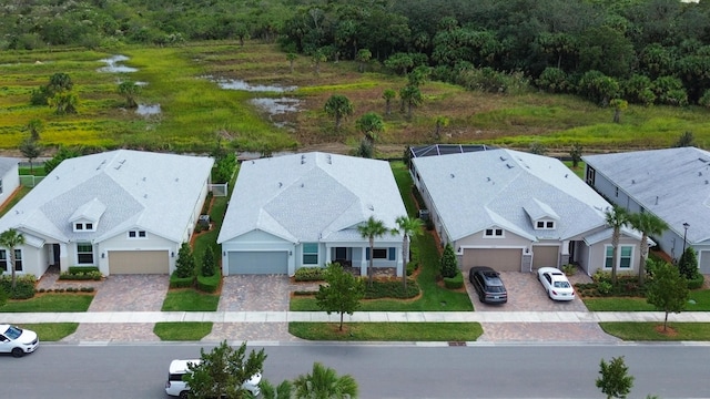 10299 SW Captiva Dr, Port Saint Lucie, FL 34987 - aerial view of property and surrounding area featuring a forest and a large body of water