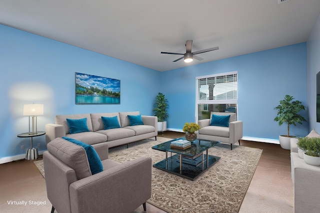 10299 SW Captiva Dr, Port Saint Lucie, FL 34987 - living room with a ceiling fan, baseboards, and carpet
