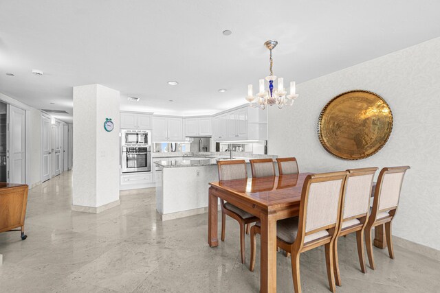 800 Ocean Dr Unit 204, Juno Beach, FL 33408 - dining space featuring a chandelier, baseboards, and recessed lighting