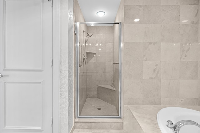800 Ocean Dr Unit 204, Juno Beach, FL 33408 - full bath with a stall shower, a bath, and a sink