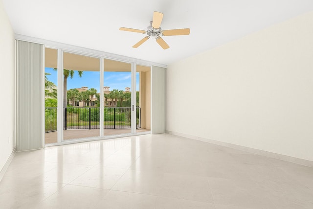 800 Ocean Dr Unit 204, Juno Beach, FL 33408 - empty room featuring floor to ceiling windows, plenty of natural light, a ceiling fan, and baseboards